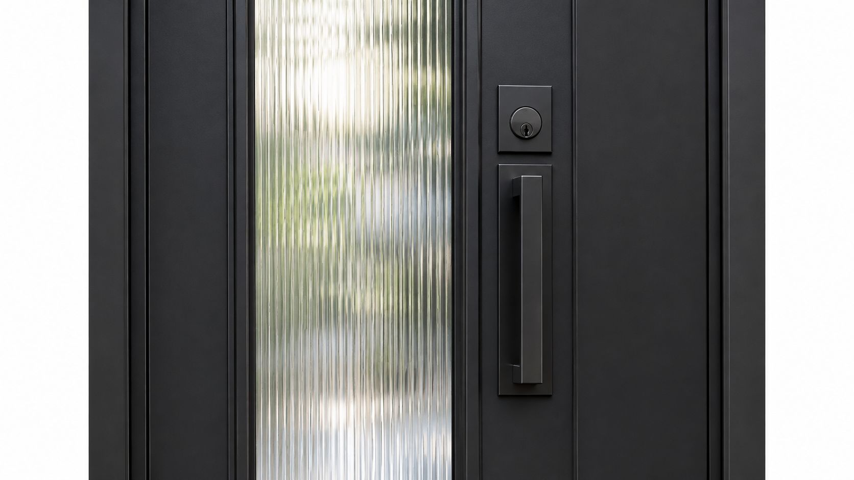 Close-up of a modern matte black entry door featuring a vertical fluted glass panel and hardware.