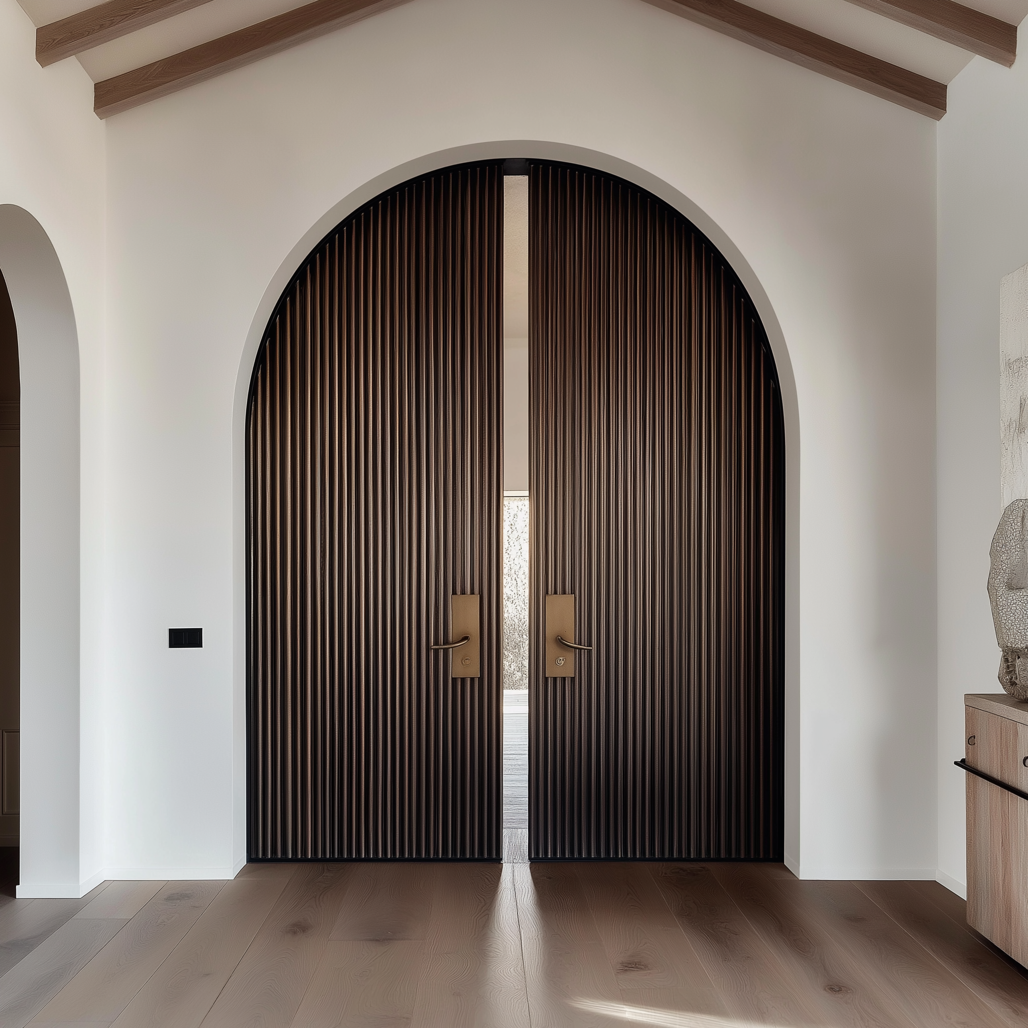 Iron Pivot Arched Entry Door - Custom Fluted Design